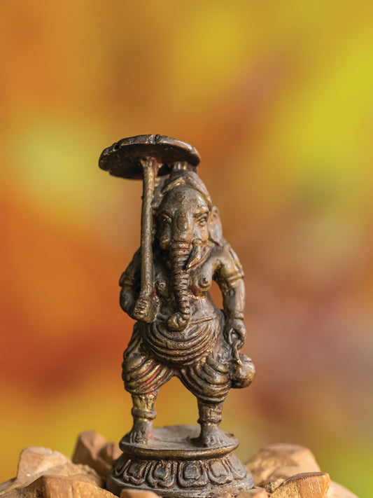 "Umbrella of Blessings: Lord Ganesha’s Protective Aura"